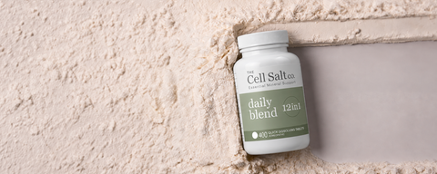 Daily Blend bottle of all 12 cell salts (Schuessler tissue salts) on a natural stone background