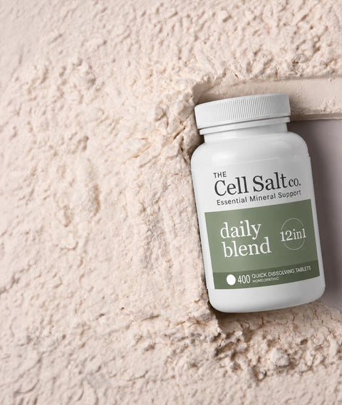 Daily Blend 12 cell salts bottle by The Cell Salt Co. on a textured stone surface